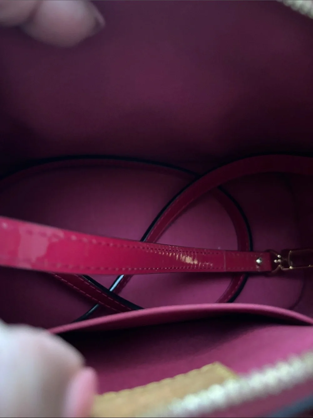Red Louis Vuitton Alma BB crafted from glossy Monogram Vernis patent leather